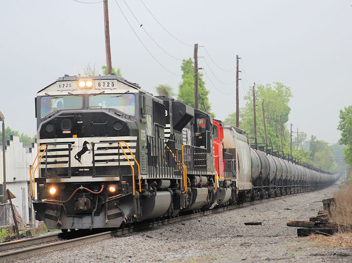 UntitledSouthbound ethanol train K68417 at New Bridge Rd, Bergenfield, NJ with an NS (ex CR) SD60M leading an NS 70ACe and a CN SD40-2W. 5/20/13